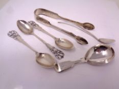 A small quantity of silver cutlery including caddy spoon, sugar tongs, teaspoons, 103.3g.