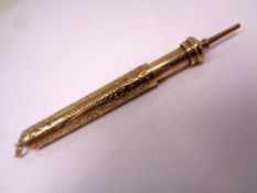 A 9ct gold propelling pencil.