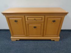 A Rossmore Furniture seven piece dining room suite comprising of sideboard, extending table,