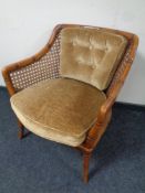 A faux bamboo and bergere armchair
