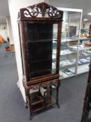 A 20th century Chinese style carved display cabinet (af)