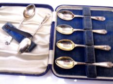 A set of six silver tea spoons with golf terminals