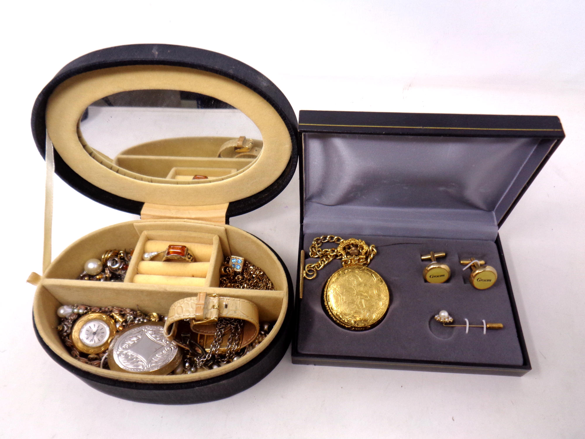 A gilt metal pocket watch in case with cufflinks and tie pin together with a box of costume