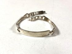 A silver ID bracelet.