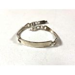 A silver ID bracelet.