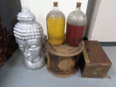 A painted concrete buddha head together with two vintage glass jars,