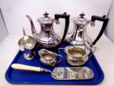 A pair of silver plated teapots together with further silver plated items to include milk jug,