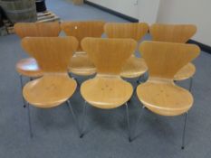 A set of seven late 20th century Fritz Hansen shaped plywood dining chairs on metal legs