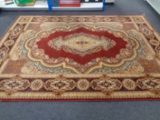 A machined Persian design carpet on gold and red ground with central medallion