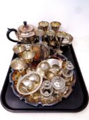A tray containing assorted plated wares to include cruet set serving tray, napkin rings, teapot,