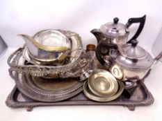 A silver plated twin handled serving tray on raised feet together with a quantity of plated wares