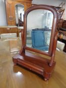 A 19th century mahogany toilet mirror