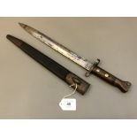 A British model 1888 bayonet in leather scabbard