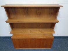 A mid 20th century Danish teak bureau cupboard together with a pair of open bookshelves
