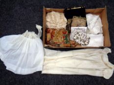 A box of table linen, vintage purses and hand bags,