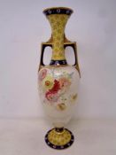 An antique Royal Doulton transfer printed twin handled vase with gilding. Height 31.