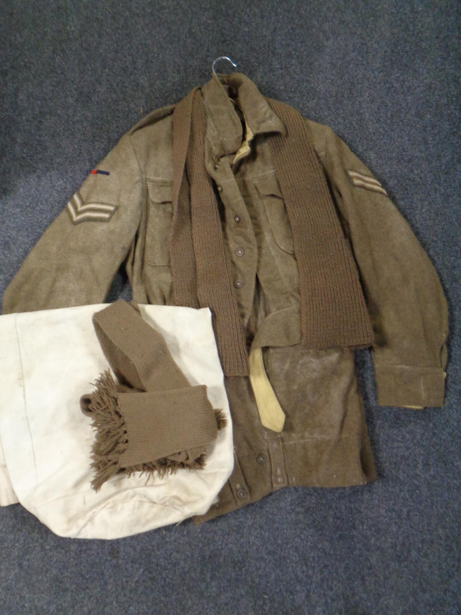A vintage British Army corporal's two-piece uniform together with two woolen scarves and a canvas