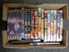 A box containing DVD box sets to include CSI,