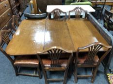 A Victorian mahogany flap sided dining table together with a set of six 19th century mahogany