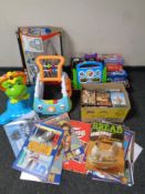 A quantity of children's toys to include V-tech bouncing frog, baby walker, DVDs games, calendars,