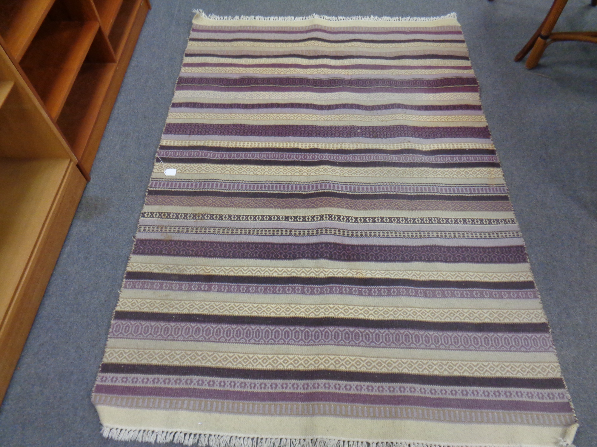 A striped kilim rug,