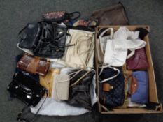 A box containing assorted lady's hand bags including leather and crocodile skin examples