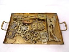 A brass twin handled serving tray, horse brasses, candle snuffers, letter openers,