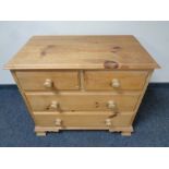 A stripped pine four drawer chest