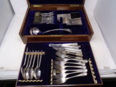 An Edwardian oak canteen with lift out tray of silver plated cutlery