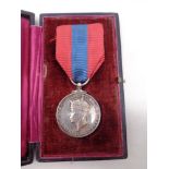 A George IV faithful service medal on ribbon in case.
