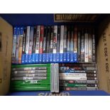 A box containing Xbox one, Playstation 4 and PSP games and UMDs to include Call Of Duty,