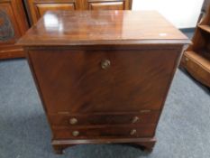 A mahogany faux front record cabinet fitted two drawers