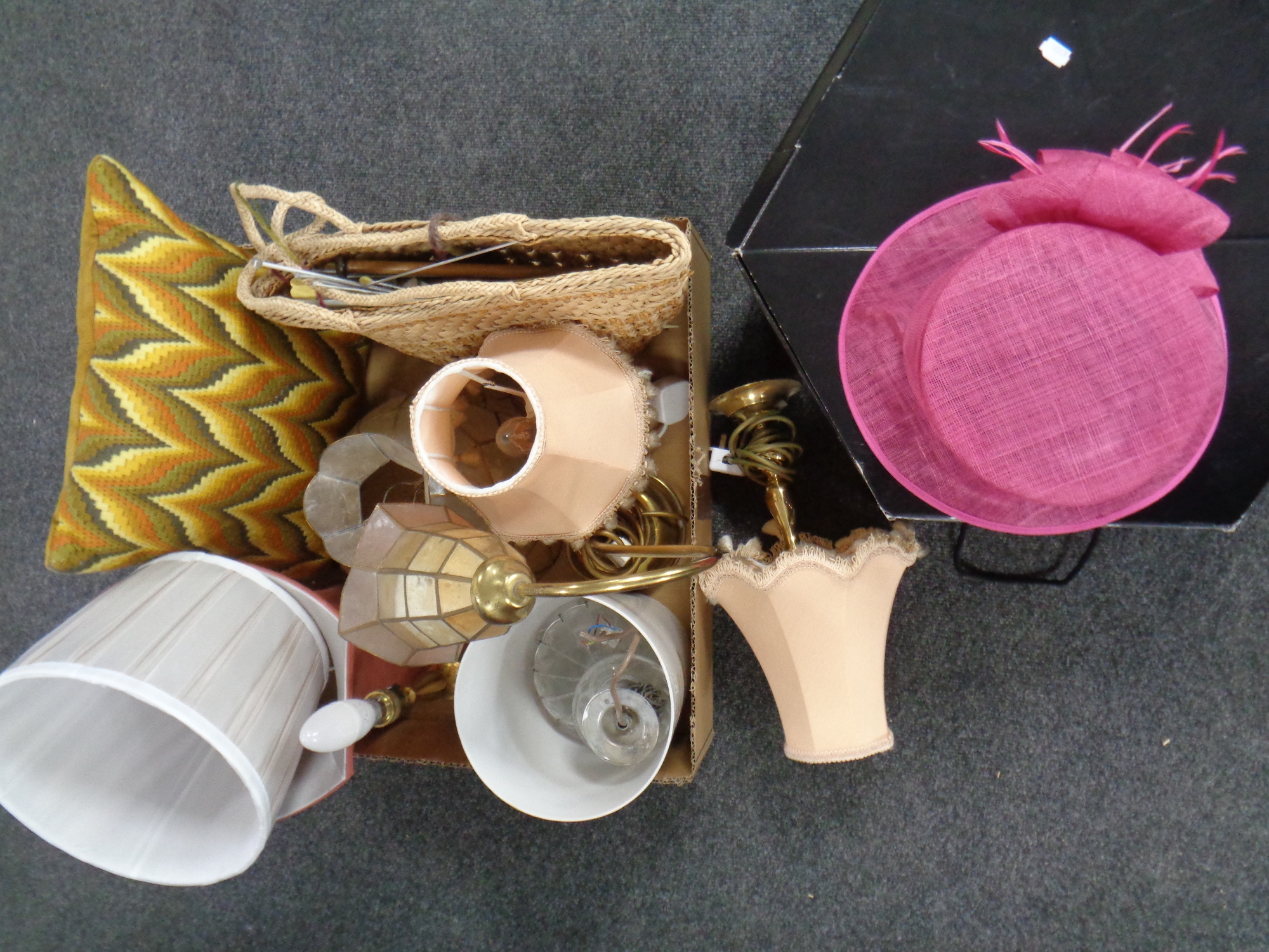 A box containing assorted brass table lamps, lamp shades, wicker basket containing knitting needles,