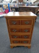 A Georgian style Yew wood four drawer chest