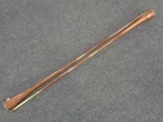 A pair of copper and brass hunting horns, length 113 cm.