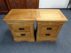 A pair of contemporary oak two drawer bedside chests