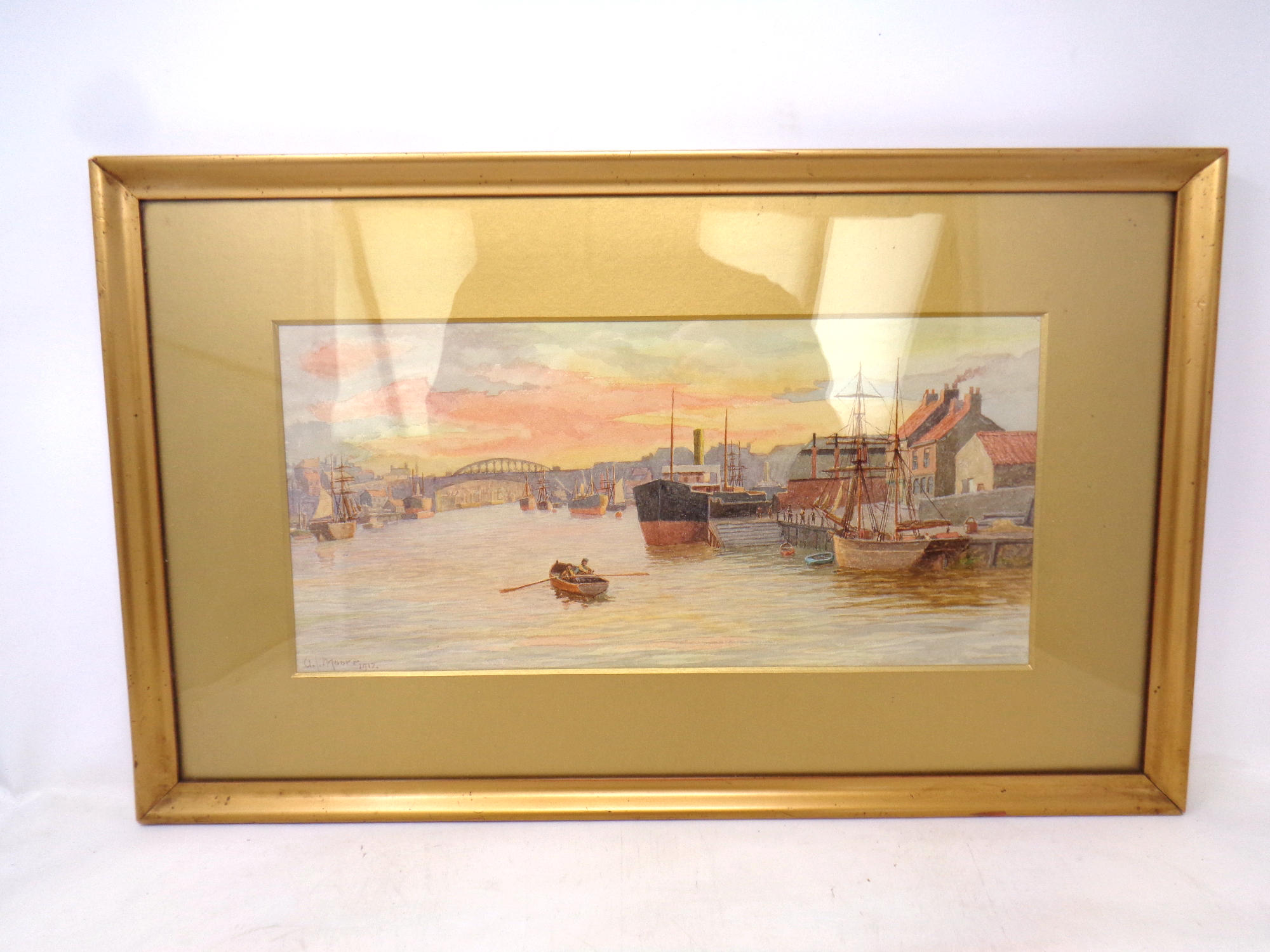 An A L Moore watercolour, boats on the River Tyne with bridges beyond.
