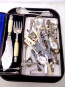 A tray containing antique and later plated and stainless steel cutlery,