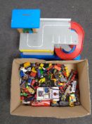 A box containing a quantity of play worn die cast vehicles,