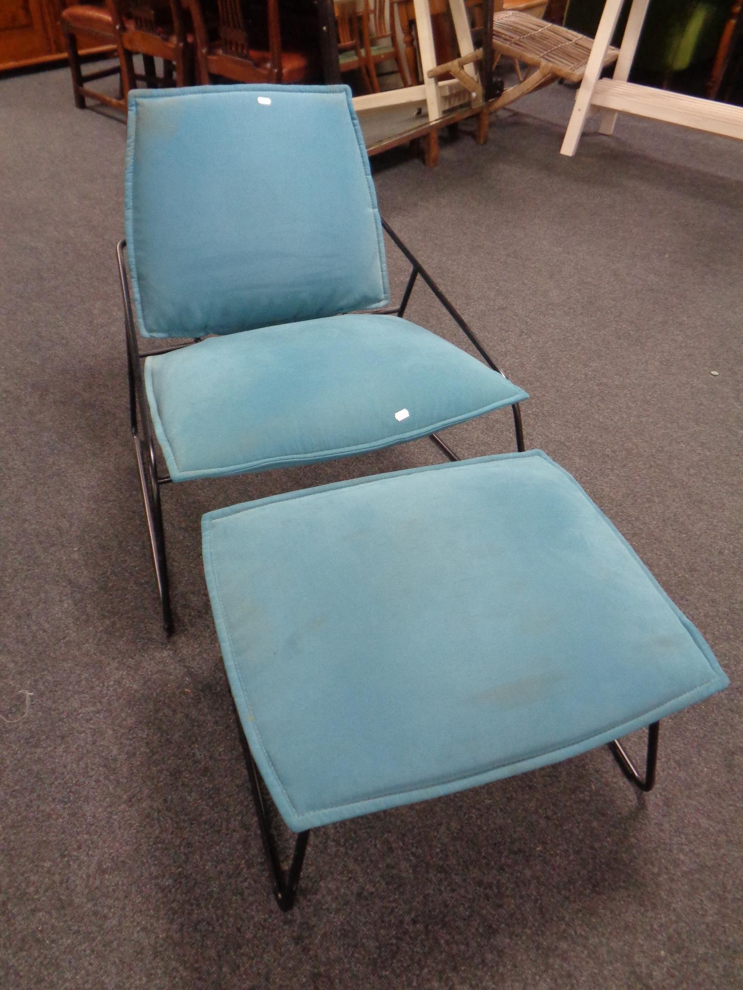 A Ikea tubular metal framed lounge chair with matching footstool upholstered in a turquoise fabric