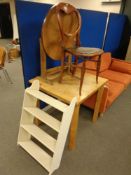 An Edwardian bedroom chair together with a folding occasional table in a walnut finish,