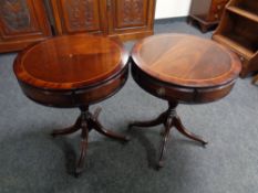 A pair of Regency style inlaid mahogany pedestal drum tables