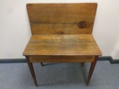 A 19th century oak turn over top tea table