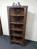 A 19th century open corner unit fitted shelves