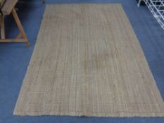 A natural flat woven rug