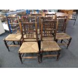 A set of nine antique rush seated country kitchen chairs