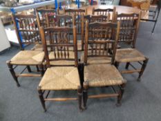 A set of nine antique rush seated country kitchen chairs