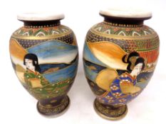 A pair of Japanese Satsuma vases, height 25 cm.