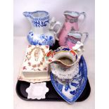 A tray containing antique ceramics to include two graduated Josiah Wedgwood jugs,