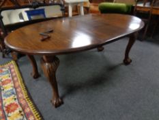 A 19th century oval wind out dining table with leaf